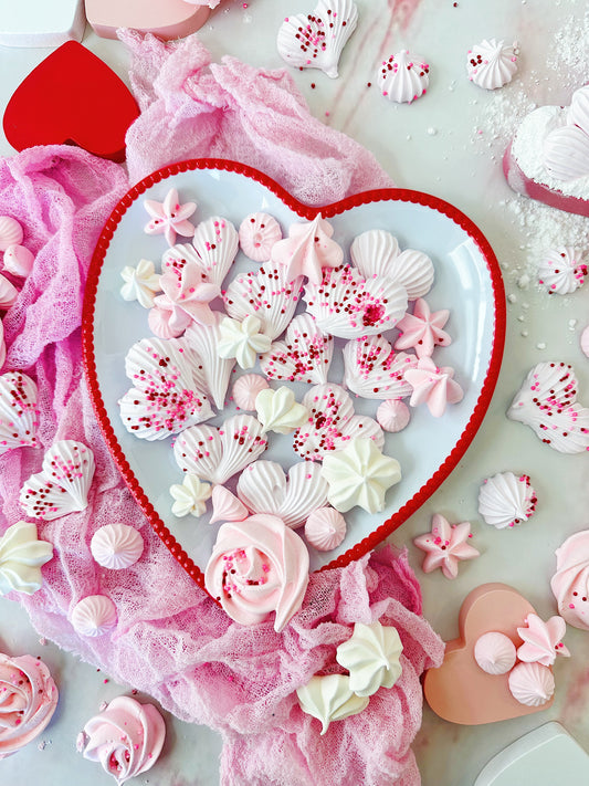 strawberry heart meringues using Whipzi™ strawberry flavor powdered sugar and Whipzi™ vanilla flavor powdered sugar for an easy meringue kisses and meringue hearts recipe