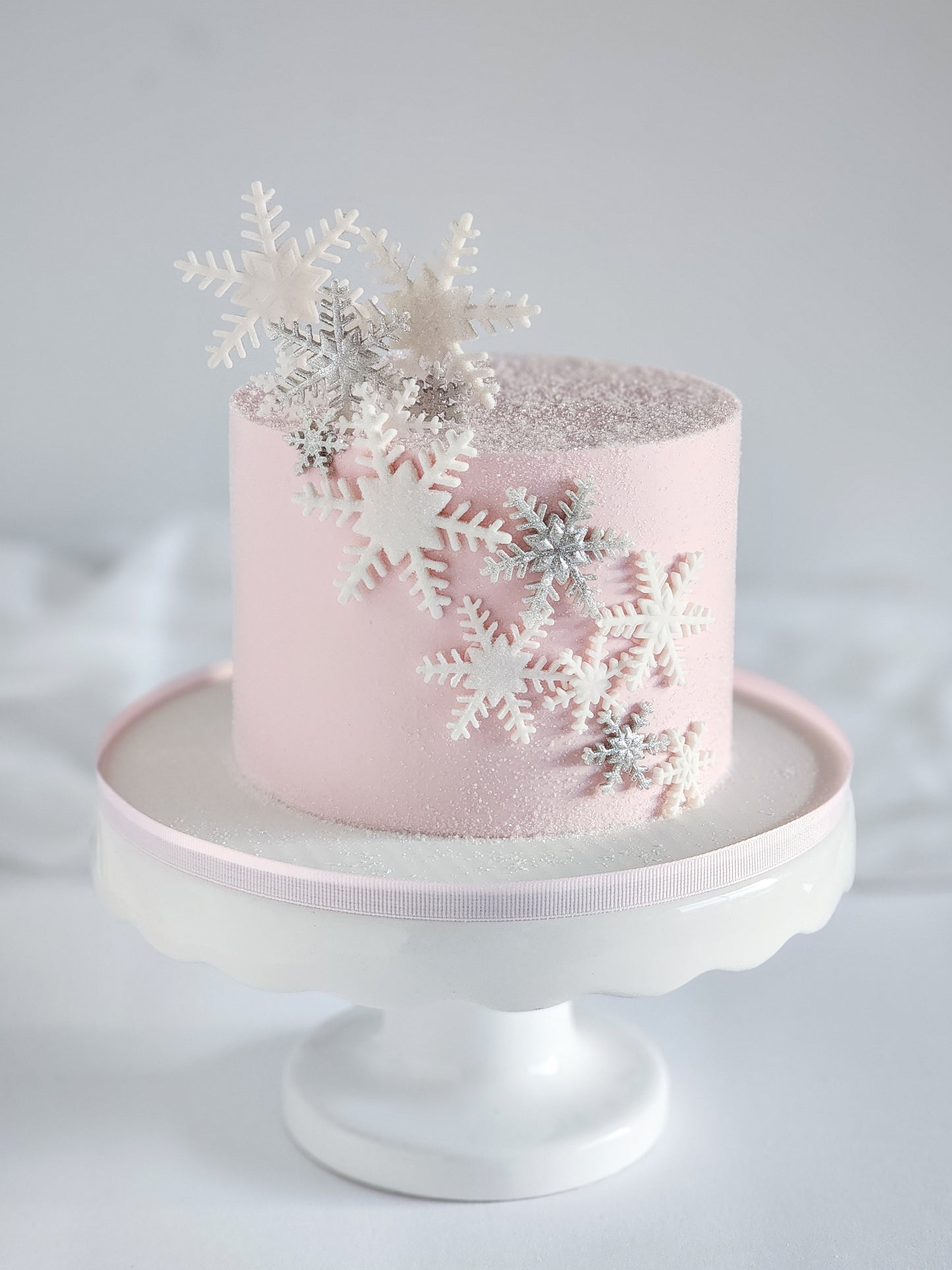 strawberry snowflake cake with strawberry swiss meringue buttercream using Whipzi strawberry powdered sugar